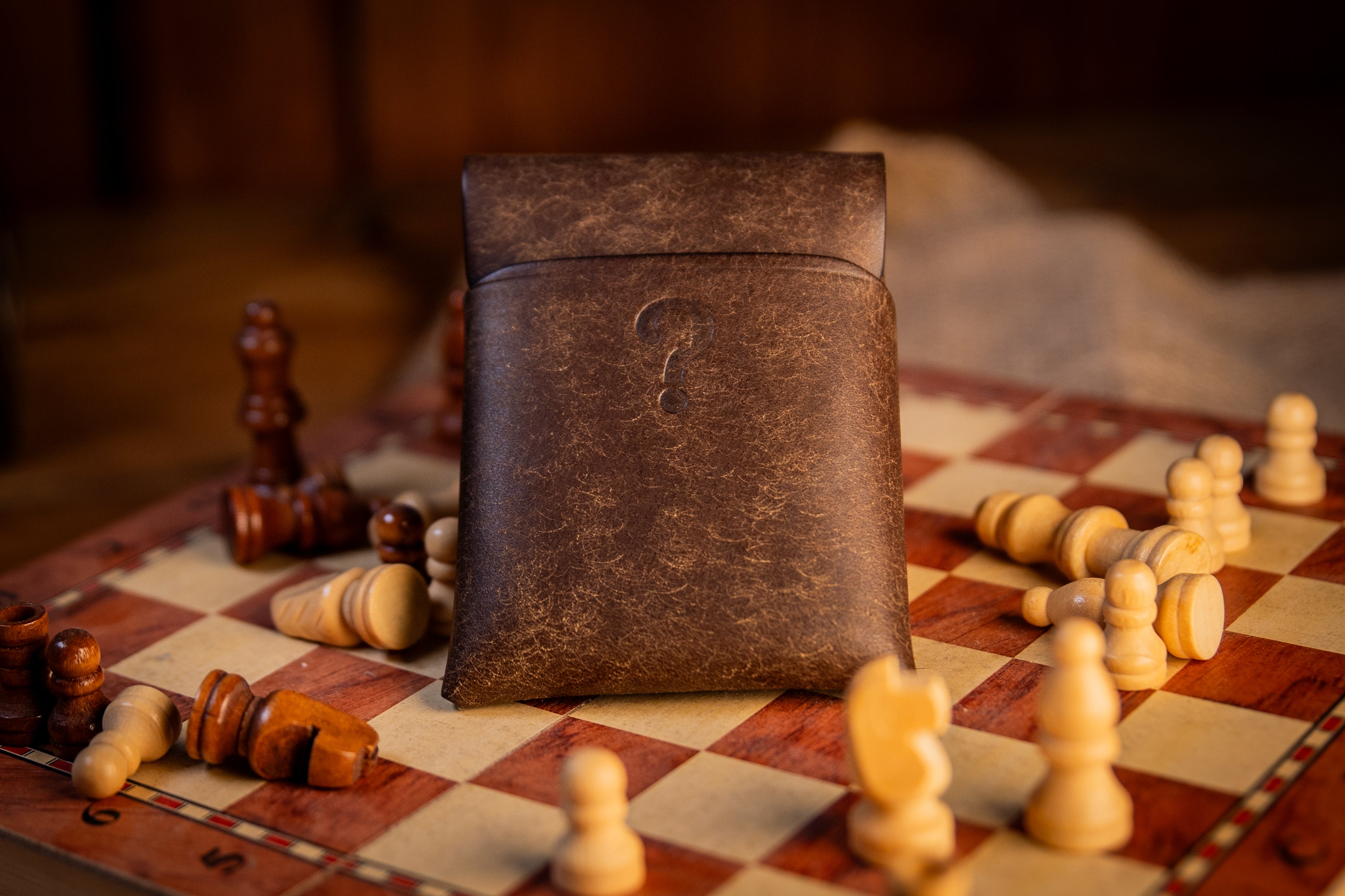 Brown pueblo leather wallet on chess board