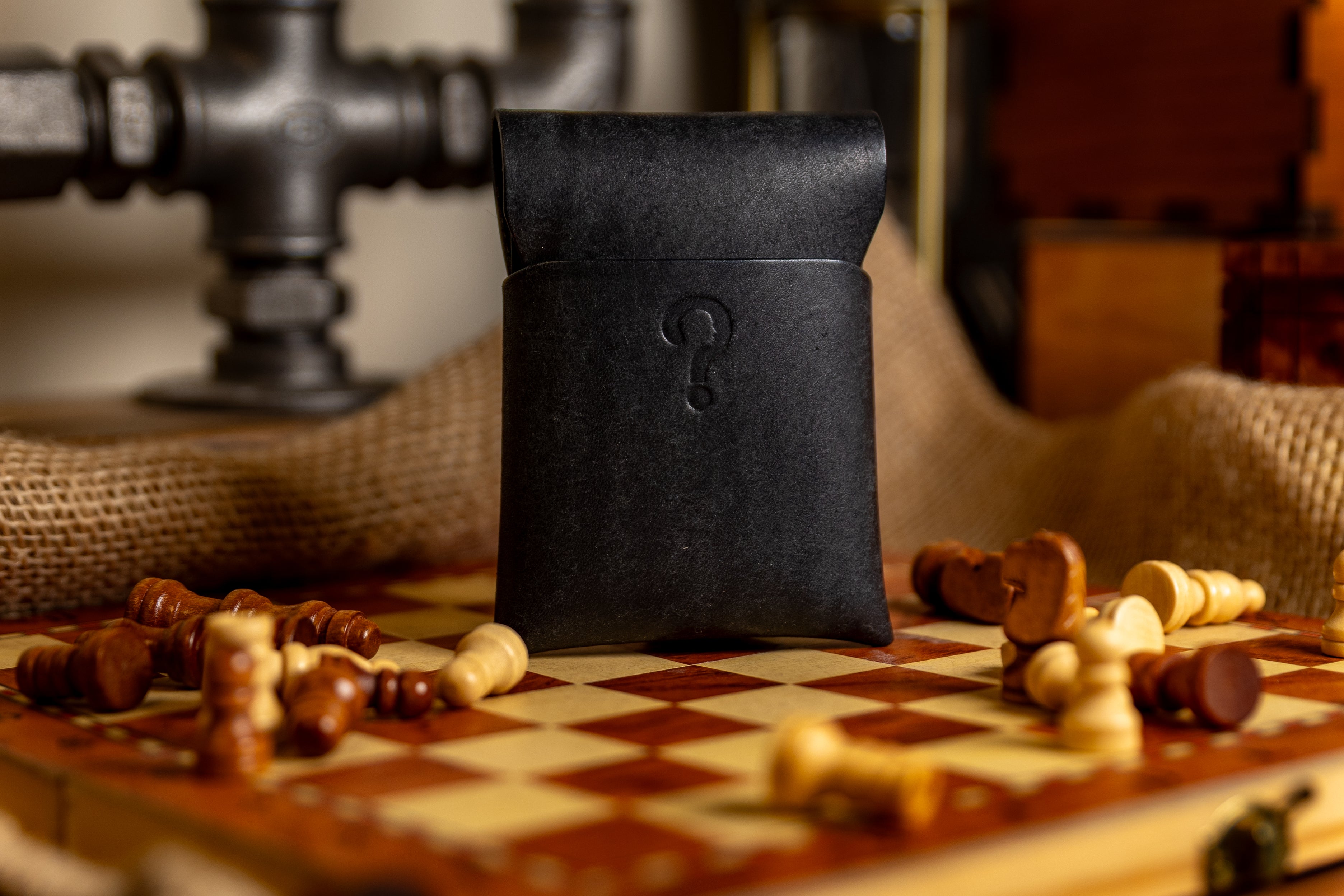 Black pueblo leather stitchless wallet with a question mark on a chessboard