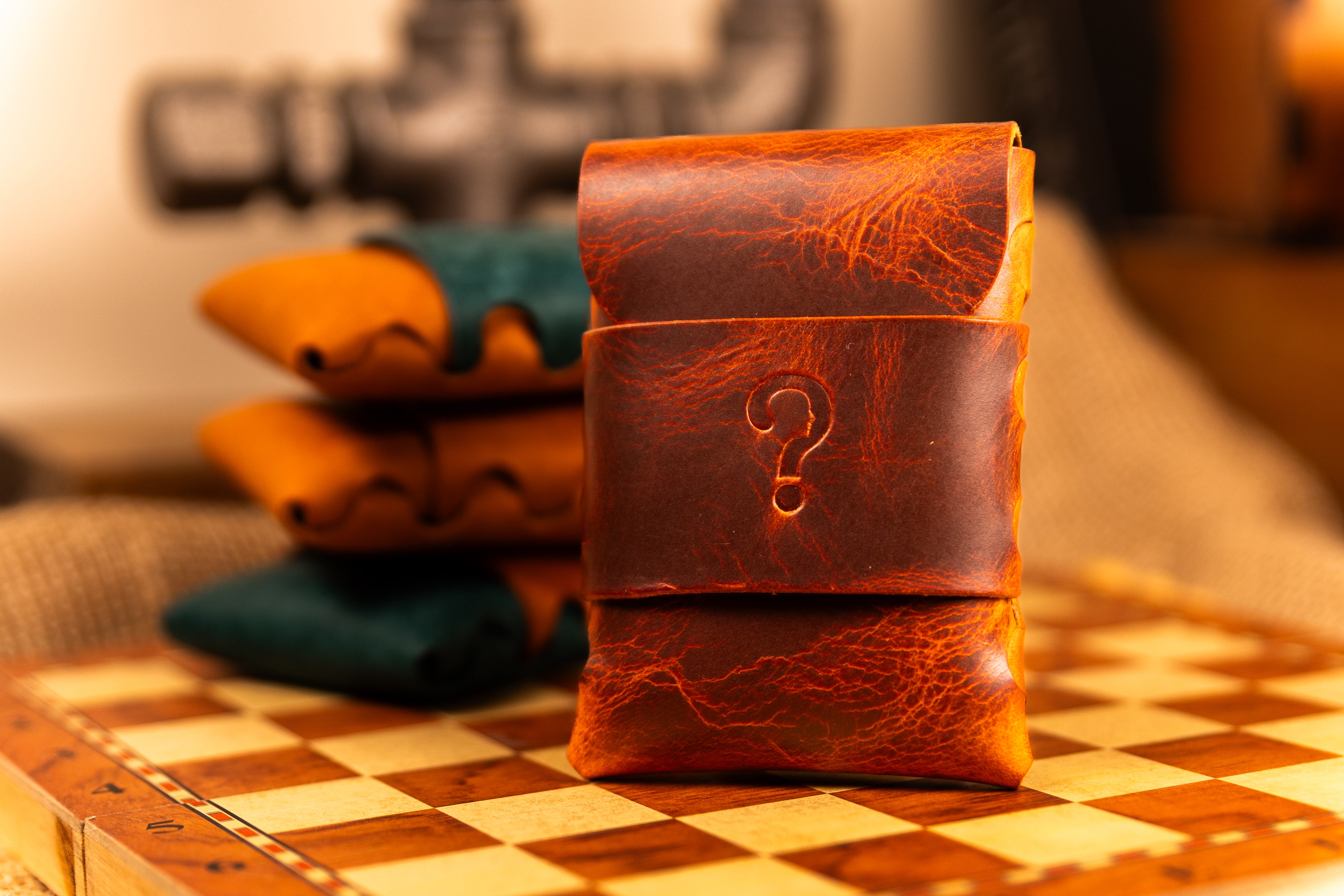 Brown wax leather wallet with question mark design on a checkered surface
