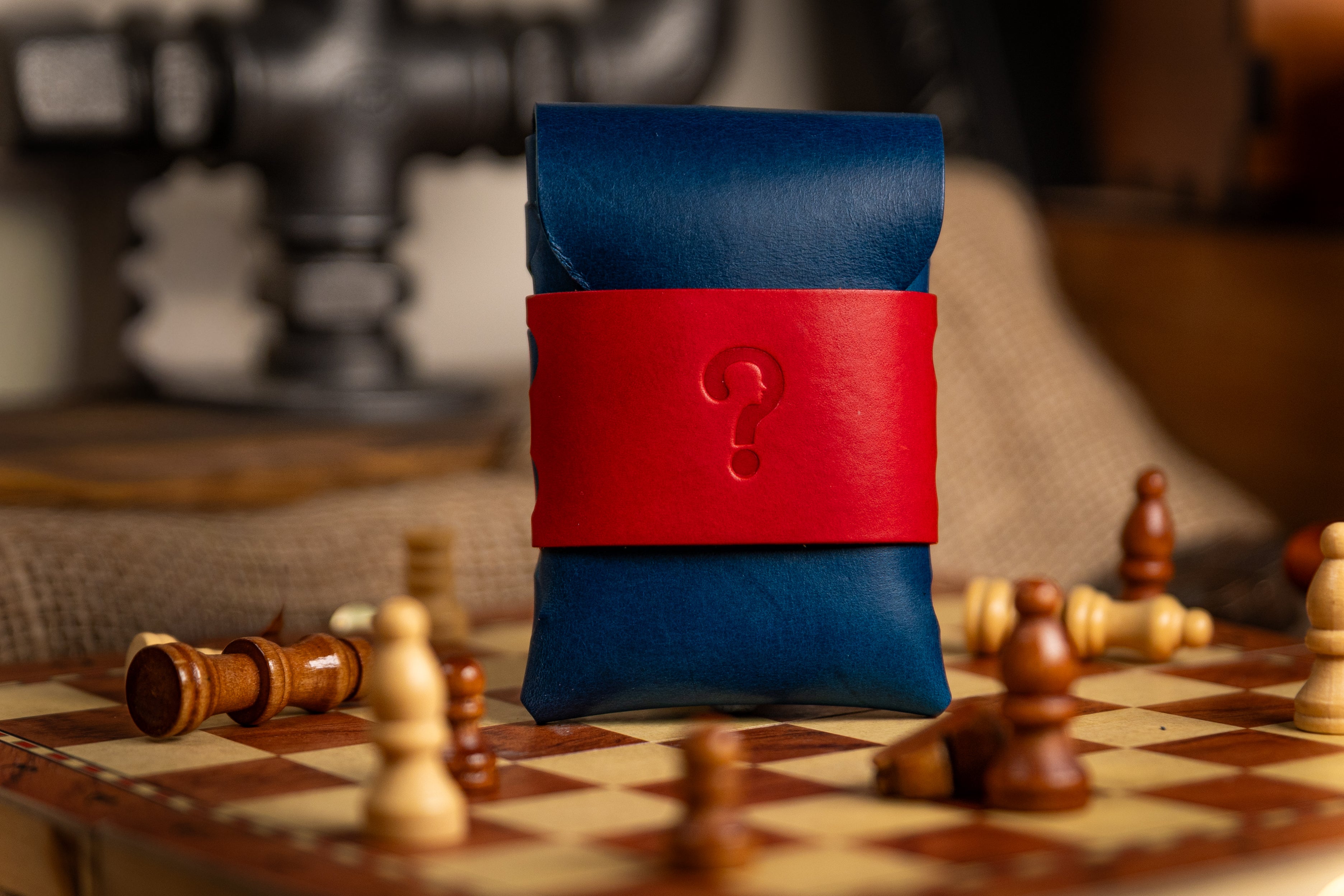 Blue and red walpier buttero leather wallet pouch with a question mark on a chessboard