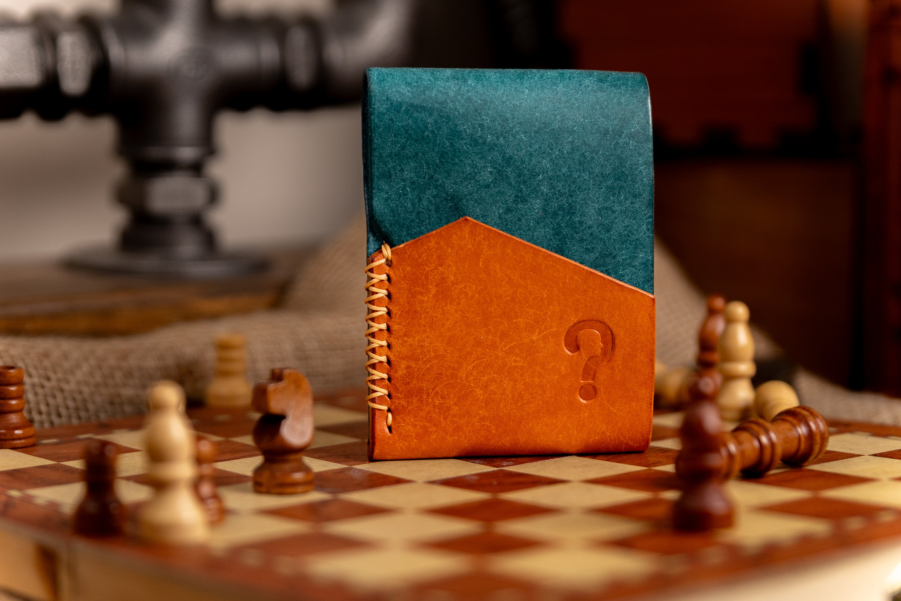pueblo leather wallet with a question mark on a chessboard